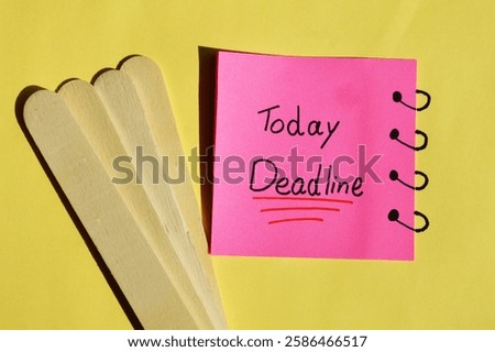 Yellow sticky note on date calendar with text written DEADLINE TODAY! concept of self warning to get job done ontime in very tight deadline to meet customers expectation