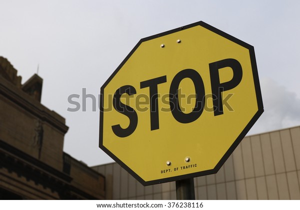 Yellow stop sign. Signs and
symbols