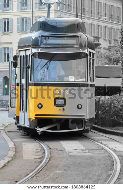 Yellow street car in\
milan city in italy 
