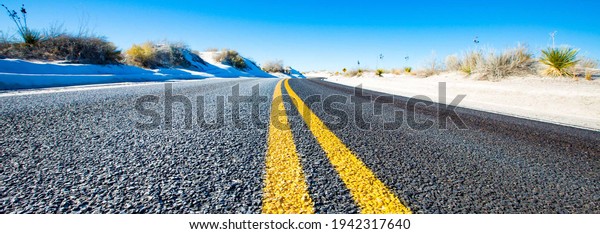 Yellow stripes on asphalt\
road