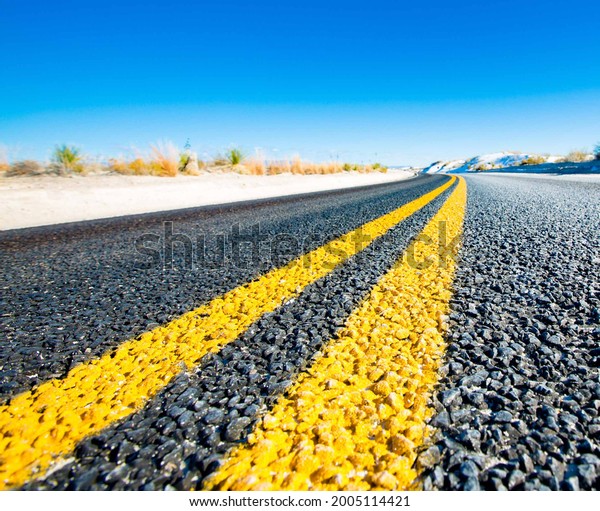 Yellow stripes on asphalt
road