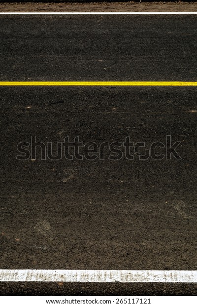 Yellow stripes on the\
road as a background