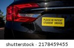 Yellow Student Driver Bumpersticker on black car