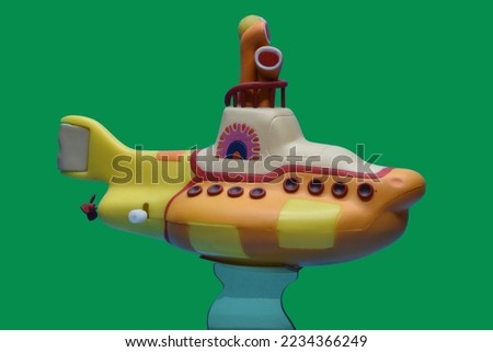 Yellow Submarine isolated on green sea background