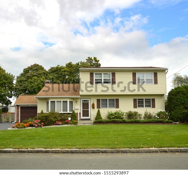 Yellow Suburban Ranch Home Second Story Stock Photo Edit Now
