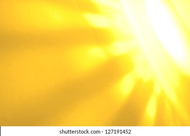 yellow sun rays on a wall