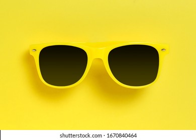 Yellow Sunglasses On Yellow Background