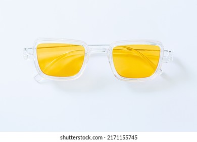yellow sunglasses white background Anti  glare glasses for the driver in metal frame and yellow glasses white background 