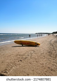 Yellow Surfboard On The Beach 