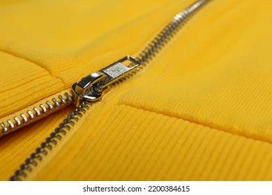 Yellow Sweatshirt With Zipper As Background, Closeup View