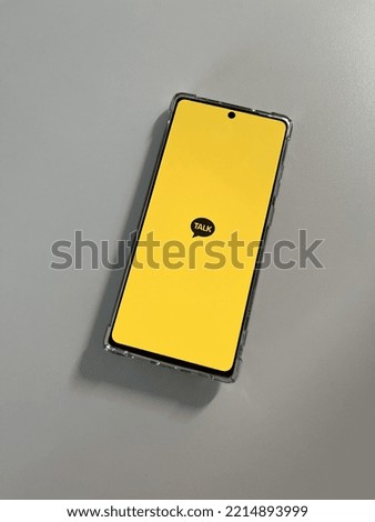 Yellow Talk app loading phone Stock photo © 
