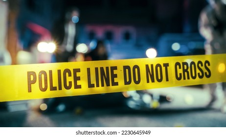 Yellow Tape Showing Text "Police Line Do Not Cross" Restricting a Crime Scene Area At Night. Close Up Aesthetic Shot with Bokeh Effect and Flickering Lights. Criminal on the Loose Strikes Again - Shutterstock ID 2230645949