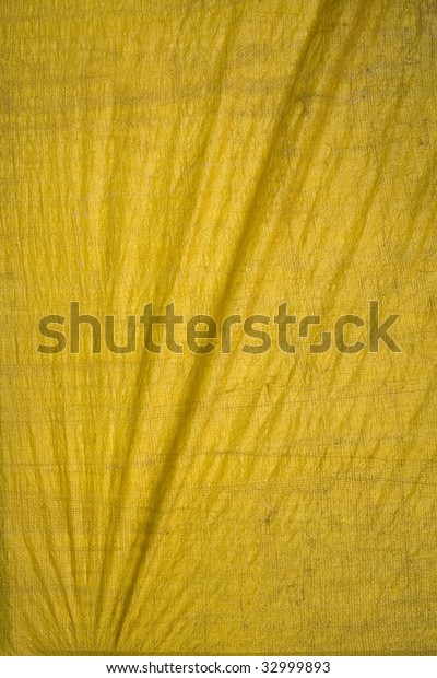 yellow tarpaulin with
folds
