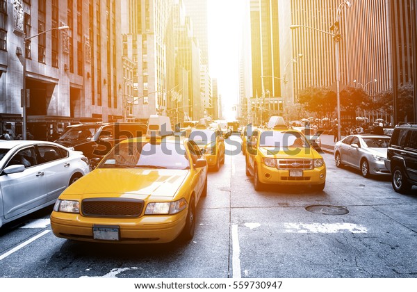 Yellow\
taxi in a Black and White New York in the\
sunset