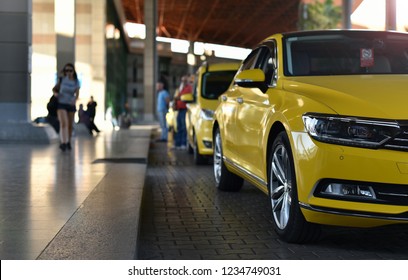 Yellow Taxi Cab In Airport