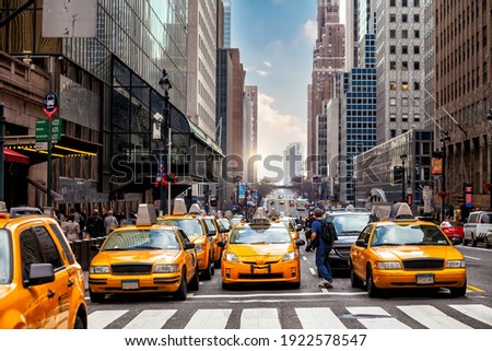 Yellow Taxi in Manhattan, New York City  in USA sunset