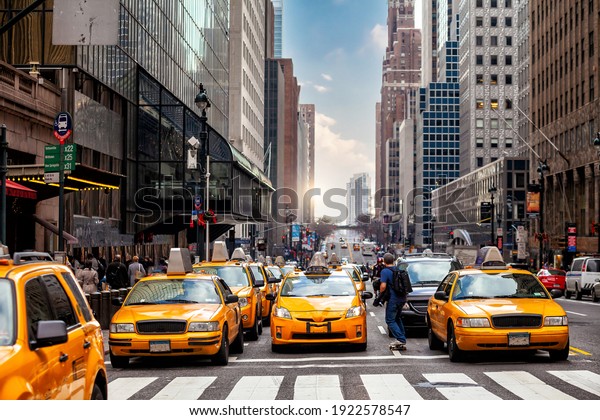 Yellow\
Taxi in Manhattan, New York City  in USA\
sunset
