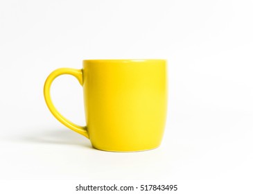 Yellow Tea Cup Isolated On White.