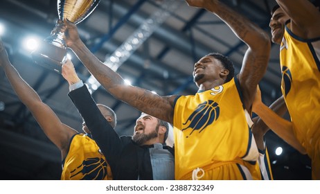 Yellow Team Basketballers Celebrating Successful Victory Over a National Basketball Club, Cheering Together with Teammates and Coaches. Low Angle Cinematic Shot with Happy Athletes. - Powered by Shutterstock