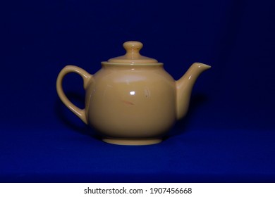 Yellow Teapot On Blue Background, Time For Tea 