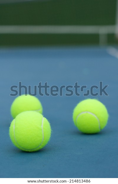 Yellow Tennis ball on the\
blue court