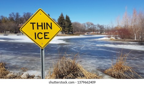 Yellow thin ice warning sign in a park. - Powered by Shutterstock