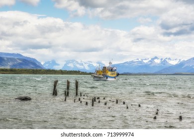 Yellow Touristic Boat And Old Wooden  Pier, Puerto Natales, Province Of Ultima Esperanza, Antartica Chilena, Patagonia