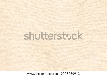 Yellow towel texture for background. Fabric or textile consist of cotton fiber material. 