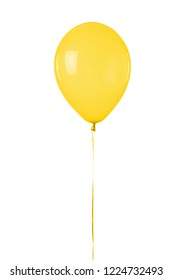 A yellow toy balloon inflated with helium, floating in front of a white background.
