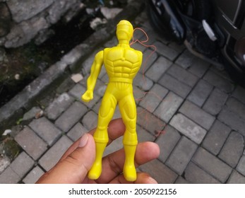 Yellow Toy Robot With Missing Arm