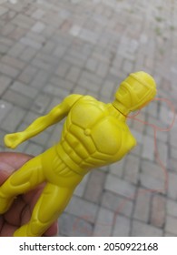 Yellow Toy Robot With Missing Arm