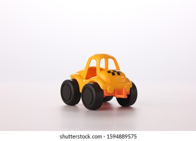 Yellow Toy Taxi On White Background.