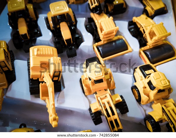 Yellow toys truck and dump\
truck