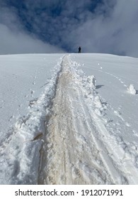 Yellow Tracks Of The Sand Blown Up From Sahara Desert On The Snow In Mountains, Alps, Aosta Valley, Italy.