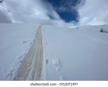 Yellow Tracks Of The Sand Blown Up From Sahara Desert On The Snow In Mountains, Alps, Aosta Valley, Italy.