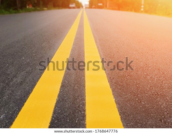Yellow traffic line color Double solid\
lines to warn prohibiting overtaking Drive strictly in accordance\
with traffic\
regulations.\
\
