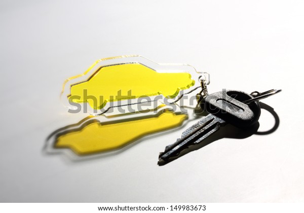 yellow transparent car\
keychain and key
