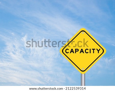 Yellow transportation sign with word capacity on blue color sky background