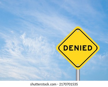 Yellow transportation sign with word denied on blue color sky background - Shutterstock ID 2170701535