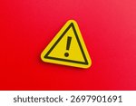 A yellow triangular warning sign with an exclamation mark. Danger, alert, caution, and safety warning concept.