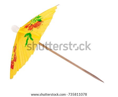 yellow umbrella for a cocktail isolated on white background