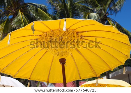 Yellow umbrella on the beach