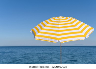 
Yellow umbrella on the top of mountain, cliff with blue sea, ocean, sky view. 
 - Powered by Shutterstock