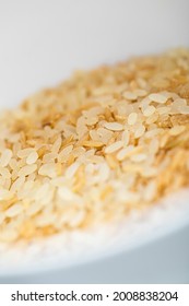 Yellow Uncooked Rice In A White Cup, Food Background