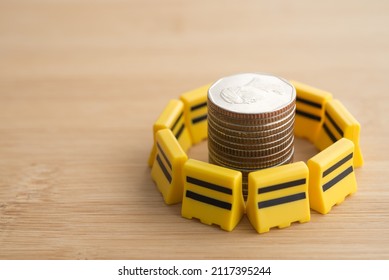 Yellow Under Construction Barrier Around Stacked Coins. Global World Economy Inflation Crisis, Repair, Fix, Revise Or Reset Investment Plan, Money Saving Management. Business, Financial And Economy.