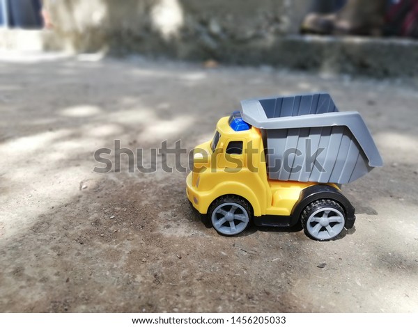 a yellow vehicle toy for\
kids