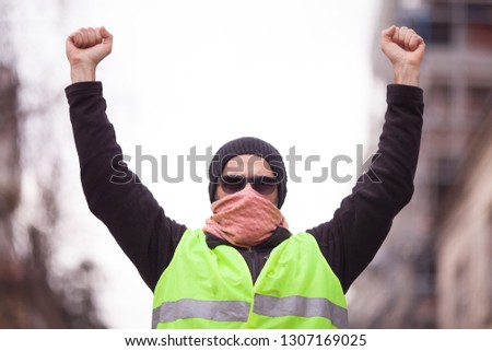 yellow vest political activist protesting on street