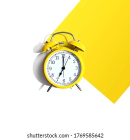 Yellow vintage alarm clock with shadow - flat lay