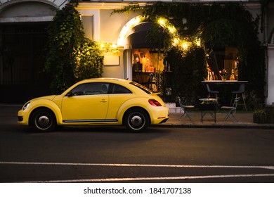 Yellow Vintage Car Parked Near A Modern Restaurant In The City Center. Ukraine, Odessa October 2020