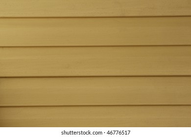 Yellow Vinyl Siding On A House; Good For Background